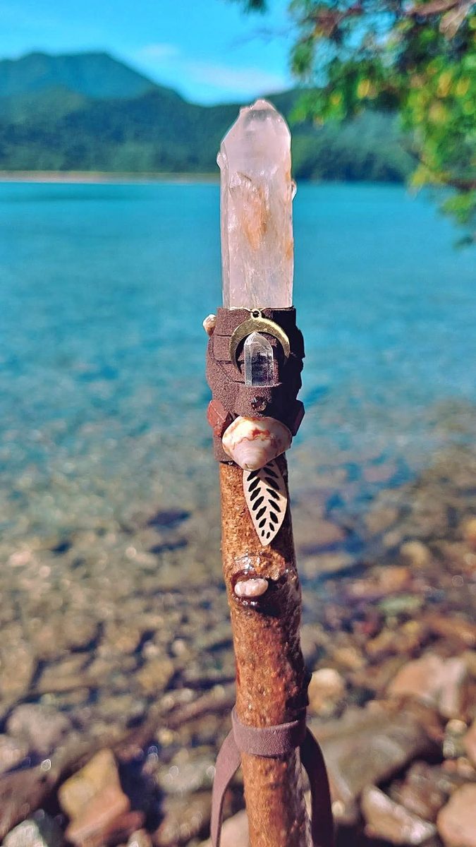 Crystal wand by turquoise lake